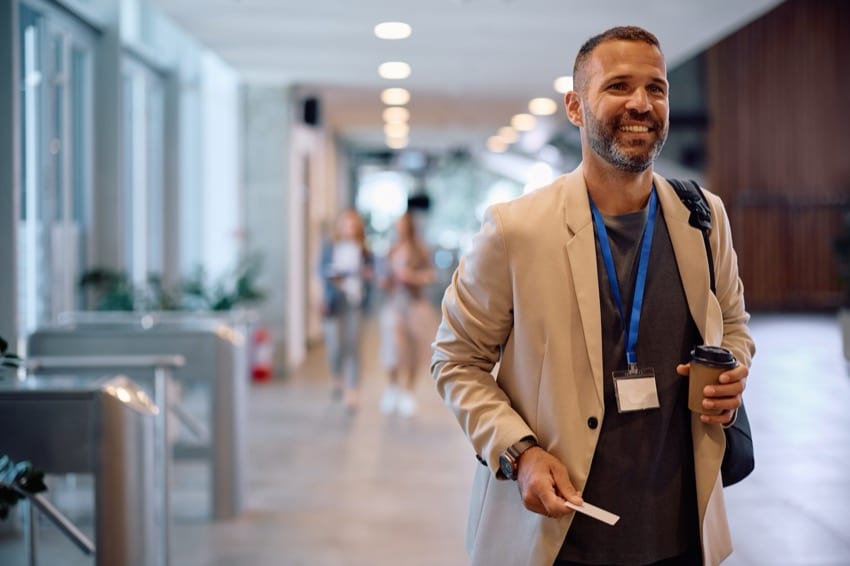 Team member walking through an office with their access card